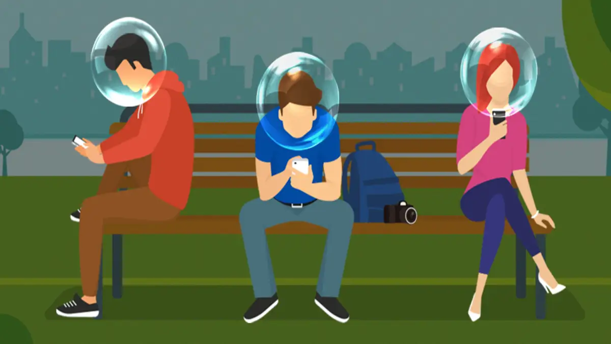 Filtro burbuja en redes sociales: personas aisladas en su propio feed Personas usando el móvil dentro de burbujas, que representan el filtro burbuja en redes sociales.