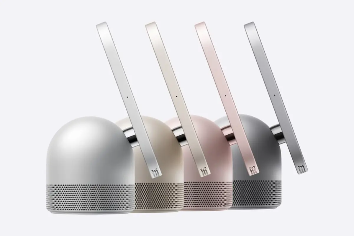 Vista de perfil de los dispositivos Apple HomeView en cuatro colores diferentes, mostrando su pantalla montada sobre una base de altavoz esférica.